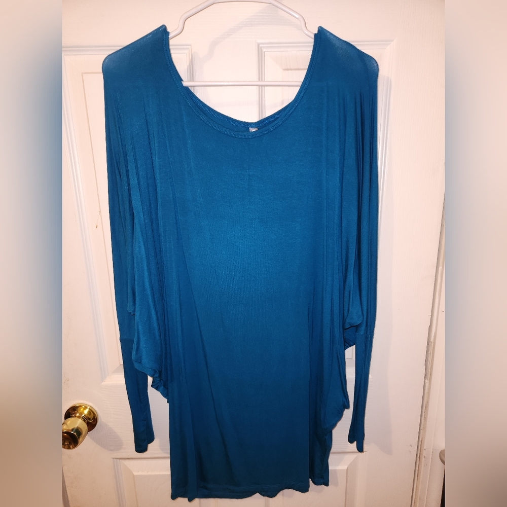 Large Turquoise winged shirt. Stretchy material. Long.